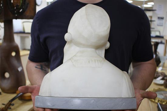 An early 20th century North European carved alabaster bust of a Flemish girl wearing a lace bonnet, unsigned, on grey marble plinth, he